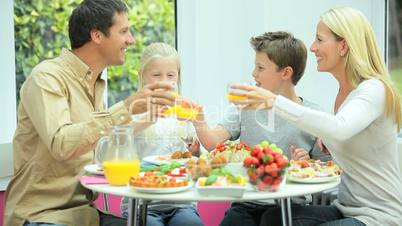 Young Caucasian Family Eating Healthy Lunch Together