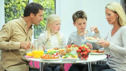 Young Family Eating Healthy Meal