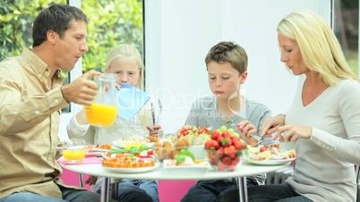 Young Caucasian Family Eating Healthy Lunch Together