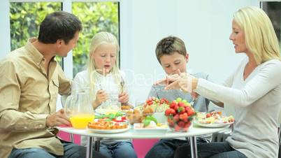 Young Family Eating Healthy Meal