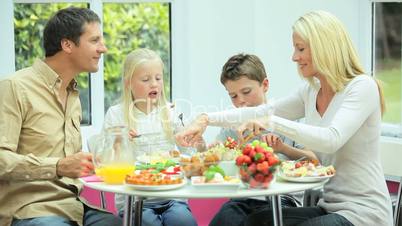 Attractive Young  Family Enjoying a Healthy Meal