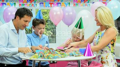 Attractive Caucasian Family Enjoying Birthday Cake