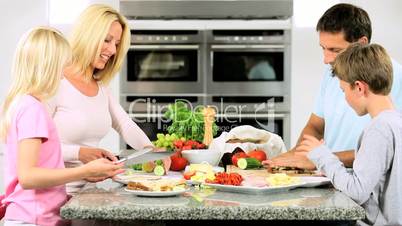 Young Caucasian Children Helping Prepare Healthy Lunch