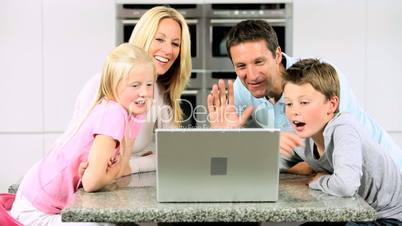 Young Caucasian Family Using Online Video Chat