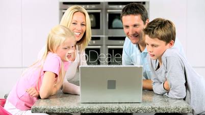 Caucasian Family Online on Laptop Computer