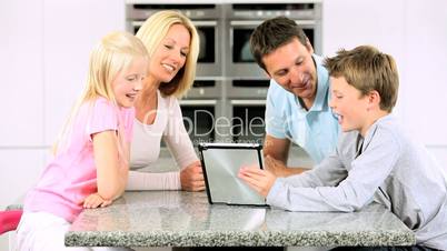 Young Caucasian Family Using Wireless Tablet