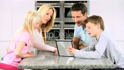 Young Caucasian Family Having Fun with  Wireless Tablet