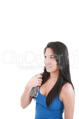 beautiful young girl drinking water after exercise