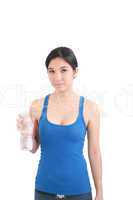 portrait of woman in fitness attire holding water bottle and smi