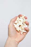Hand holding popcorn