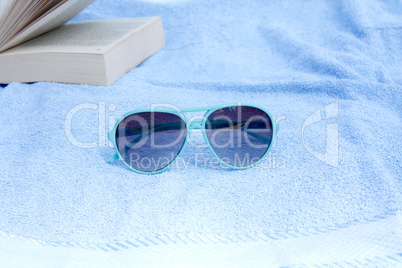 Sunglasses and towel