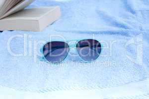 Sunglasses and towel