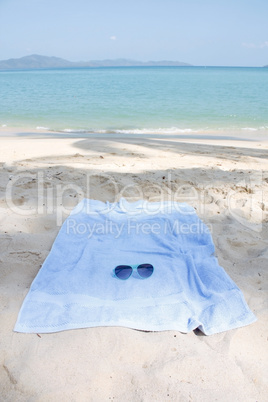 Sunglasses and towel