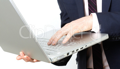 Business man with laptop typing