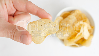 Hand with potato chip