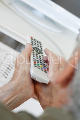 Senior man watching tv