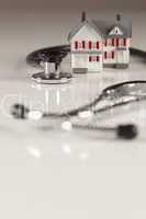 Stethoscope with Small Model Home