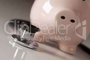 Piggy Bank and Stethoscope with Selective Focus