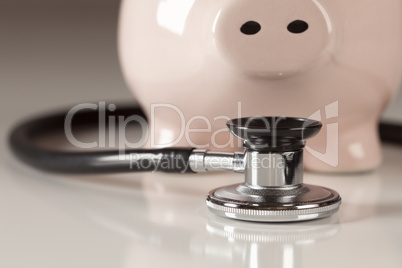 Piggy Bank and Stethoscope with Selective Focus