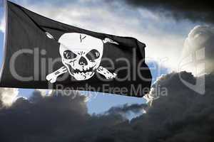 Jolly Roger (pirate flag) against storm clouds