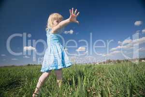 little girl on sunny meadow