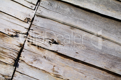 Bretterwand aus Holz mit Wurmfraß
