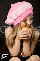 little girl biting apple