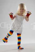 little girl in multi-coloured clothes