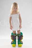 little girl in in big ski boots