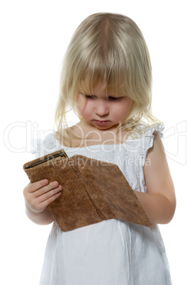 Little girl looks in purse