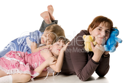 Two little girls sleeping on mum