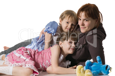 Mum and daughters lie on floor