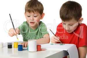 Two boys draw