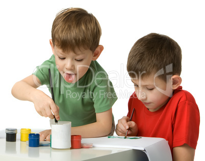 Two boys draw