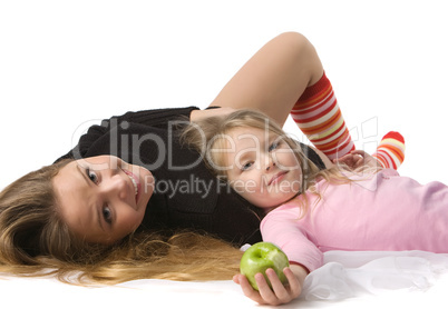 daughter lies on mum on the floor