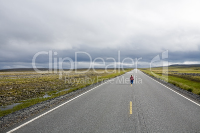 girl staying on highway