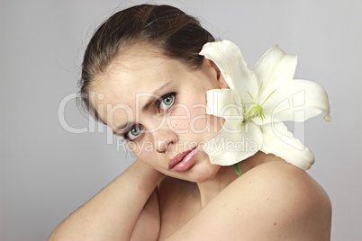girl with a lily on a shoulder