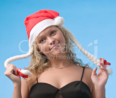 Girl in christmas hat with pigtails