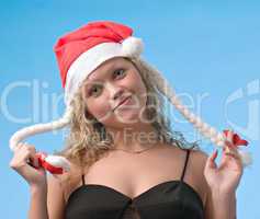 Girl in christmas hat with pigtails