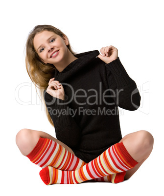 smiling girl sits on the floor