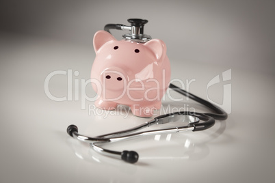 Piggy Bank and Stethoscope with Selective Focus