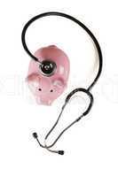 Piggy Bank and Stethoscope Isolated