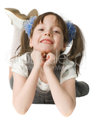 smiling girl lie on  floor