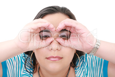 Young woman looking through imaginary binocular