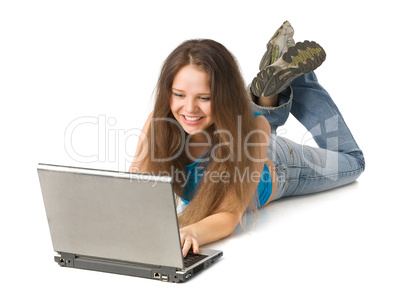 girl with laptop lying on floor