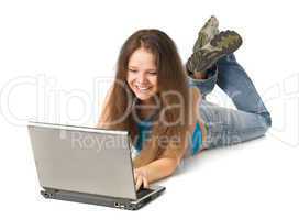 girl with laptop lying on floor