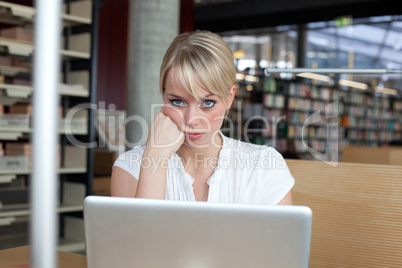 young blond woman pouts