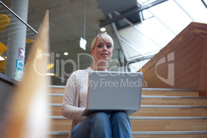 young blond woman with laptop