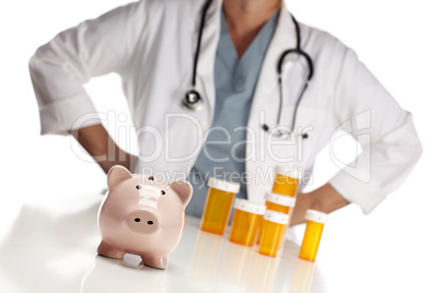 Doctor Standing Behind Medicine Bottles and Piggy Bank