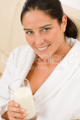 Attractive mid-aged woman drink milk for breakfast